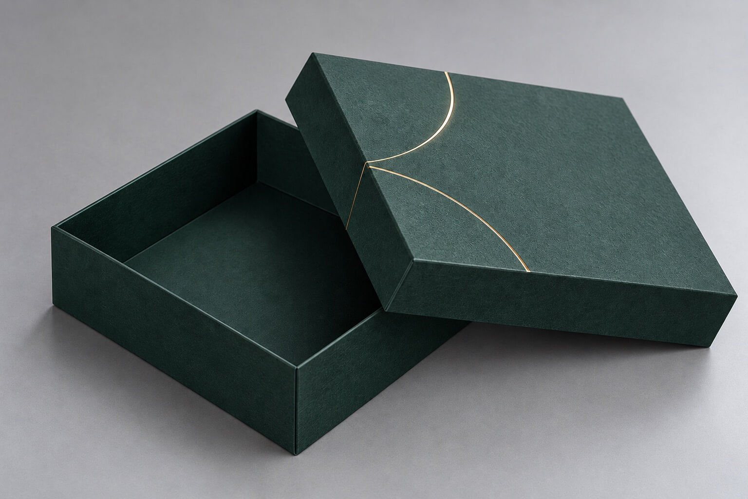 rigid boxes | green two-piece telescoping box with textured paper and gold foil details